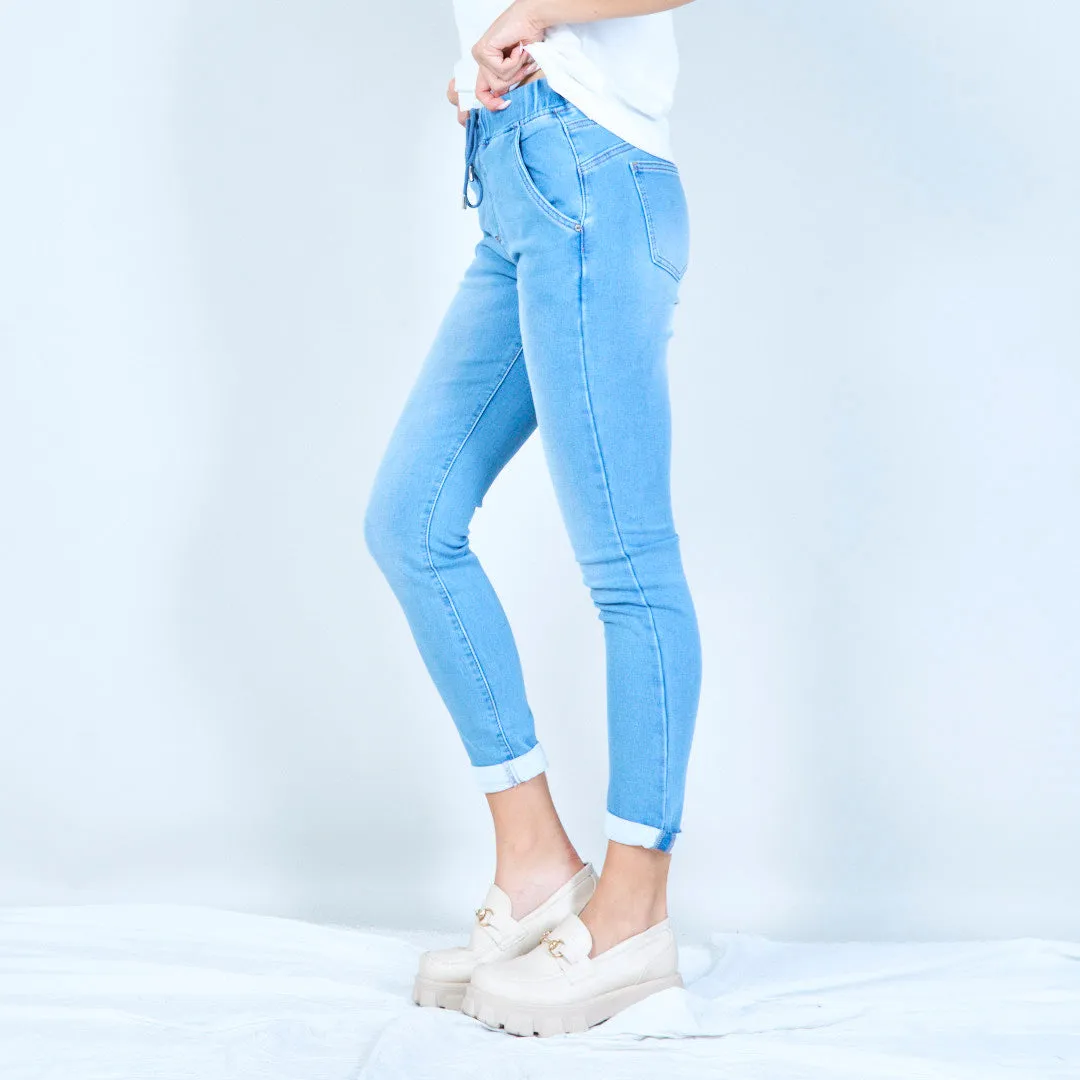 Relaxed jogger-style denim pants wholesale